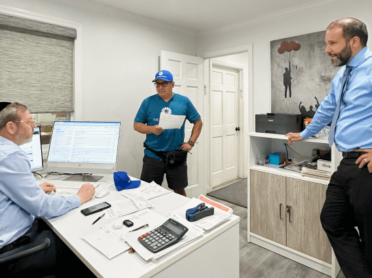 People in an office discussing